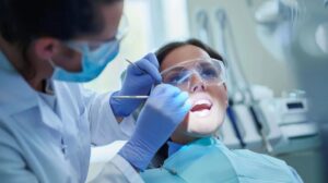 I need a realistic cosmetic dentistry image where a doctor is checking a patient.