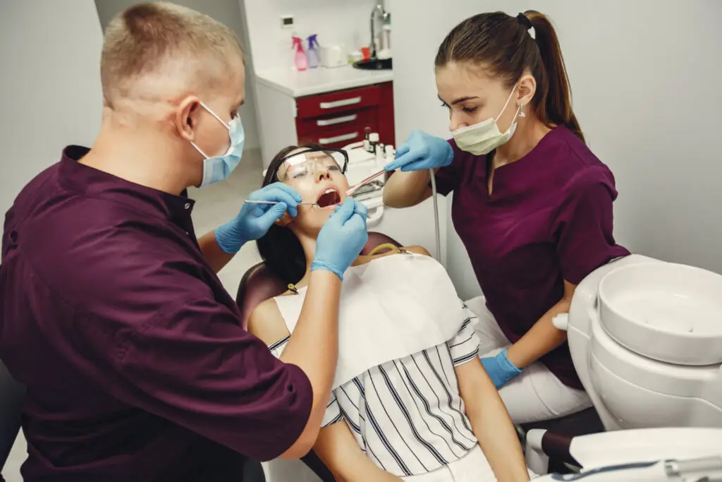 Root canal treatment in North Wales with a dentist examining a patient for tooth pain and infection.