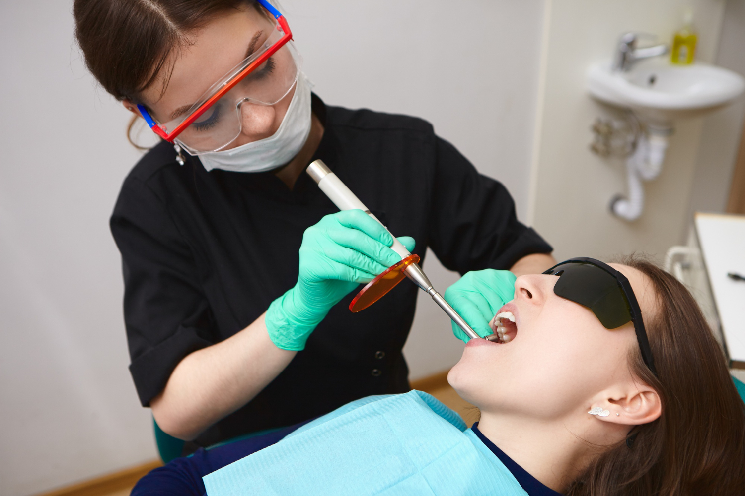 Professional dental cleaning and polishing during a routine dental checkup in a modern dental clinic.