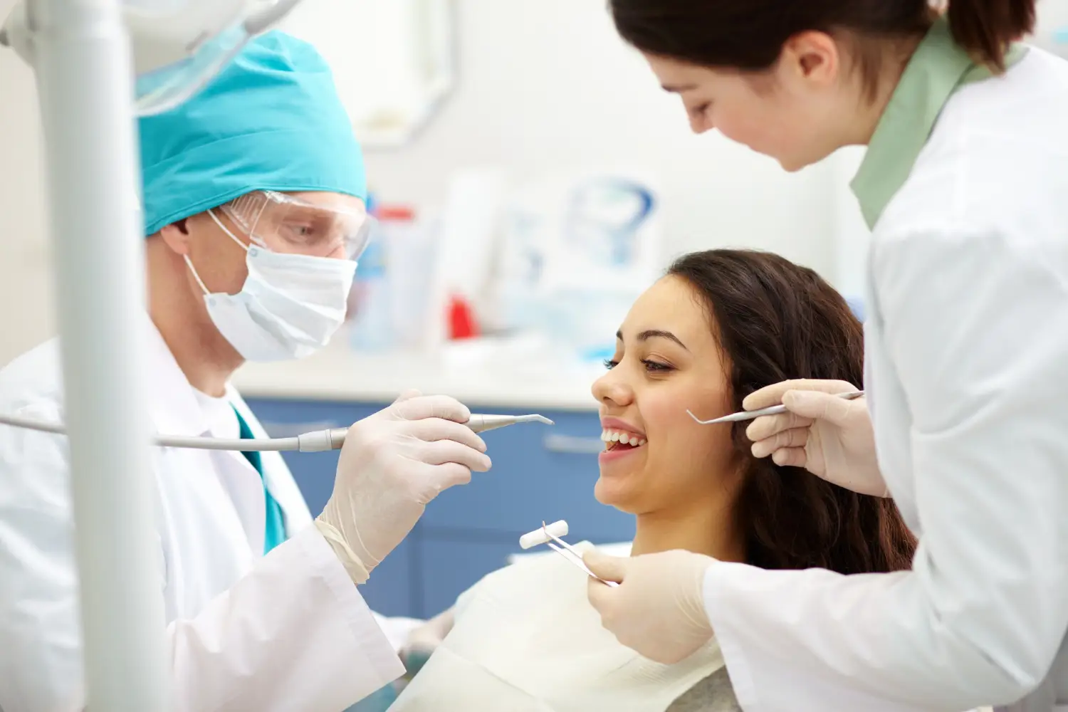 Dental cleaning appointment with dentist examining patient for preventive dental care in North Wales PA.